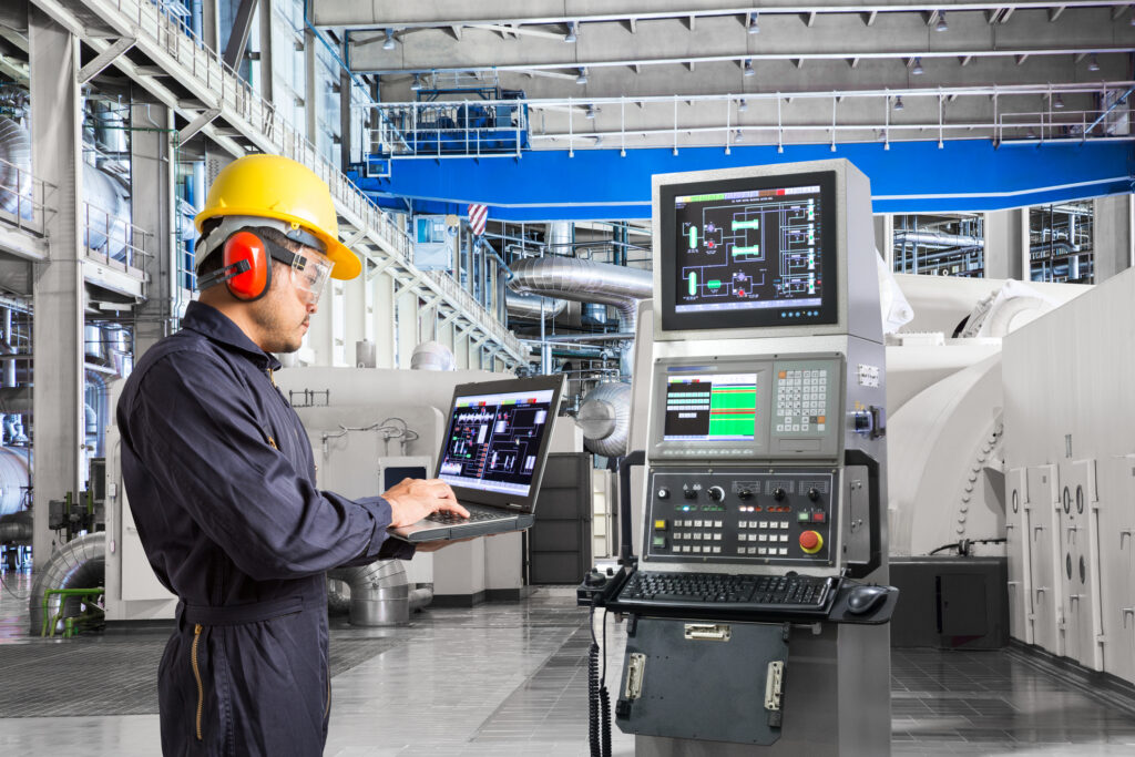 Engineer at a CNC machine control